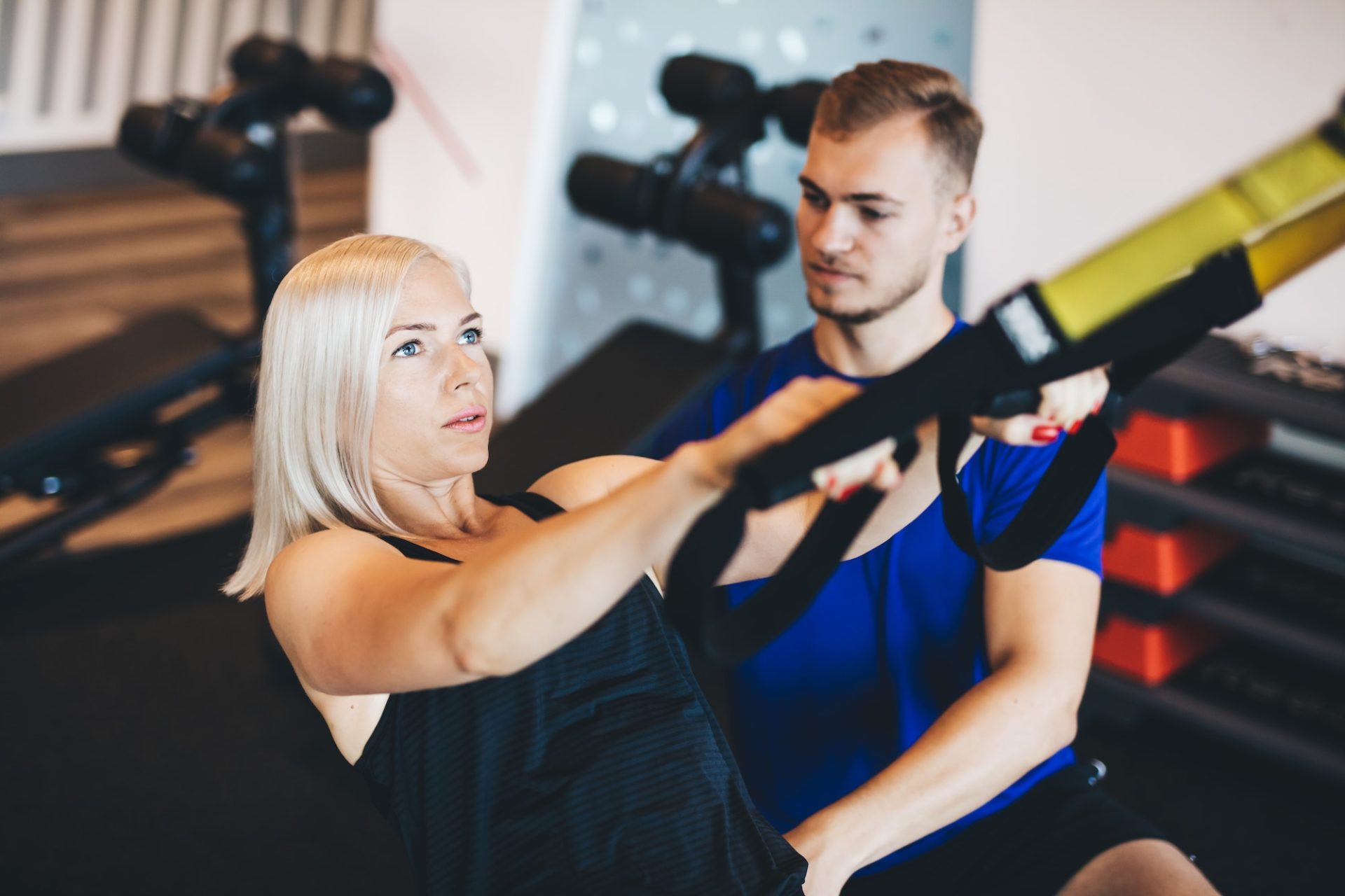 Personal trainer coaching a client